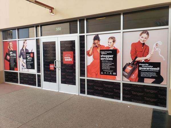 Tanger outlets window sign